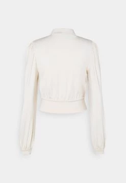 Nly by Nelly KEYHOLE FRONT Langarmshirt - Champagne für Damen | Elegantes Langarmshirt mit Keyhole-Detail -Nly by Nelly Verkaufsladen 90cc5cbb9a304aed859ec7b56d183b86